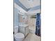 Cozy bathroom with a shower-tub combo and blue accents at 6443 34Th N Ave, St Petersburg, FL 33710