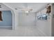 Bright dining room with white tile flooring, ceiling fan, and large window at 6443 34Th N Ave, St Petersburg, FL 33710
