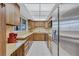 Well-lit kitchen with updated stainless steel appliances and ample cabinet space at 6443 34Th N Ave, St Petersburg, FL 33710