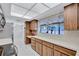 Bright kitchen featuring wood cabinets, white countertops, and a spacious open floor plan at 6443 34Th N Ave, St Petersburg, FL 33710