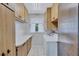 Functional laundry room with built-in cabinets and a white washer and dryer at 6443 34Th N Ave, St Petersburg, FL 33710