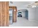 Open-concept living area flowing from the kitchen, featuring white tile floors at 6443 34Th N Ave, St Petersburg, FL 33710