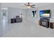 Open living room featuring white tile flooring and view to entry at 6443 34Th N Ave, St Petersburg, FL 33710
