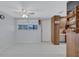 Bright room with white tile flooring, ceiling fan and a view of the back yard through the window at 6443 34Th N Ave, St Petersburg, FL 33710