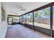 Large enclosed patio with ceiling fans offering a lovely view of the fenced backyard at 6443 34Th N Ave, St Petersburg, FL 33710
