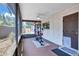 Enclosed patio includes a ceiling fan, small window, and work-out equipment at 6443 34Th N Ave, St Petersburg, FL 33710