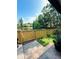 This backyard offers a water view, grass, and partial fencing at 15515 Morning Dr, Lutz, FL 33559