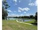 Scenic view of the lakefront and community basketball court with plenty of space for exercise and outdoor activities at 15515 Morning Dr, Lutz, FL 33559