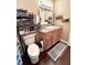 Bathroom features a single vanity, toilet, and towel rack at 15515 Morning Dr, Lutz, FL 33559