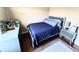 This bedroom includes hardwood floors and a modern gray color palette at 15515 Morning Dr, Lutz, FL 33559