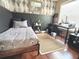 This bedroom features modern wallpaper and a desk/study space at 15515 Morning Dr, Lutz, FL 33559