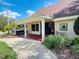 Attractive commercial building with a covered entrance, manicured landscaping, and well-lit walkway at 15515 Morning Dr, Lutz, FL 33559