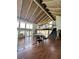 Spacious clubhouse featuring high ceilings, wood floors, a staircase, and ample natural light at 15515 Morning Dr, Lutz, FL 33559