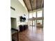 Bright clubhouse with high ceilings, wood floors, a ceiling fan, and plentiful natural light from large windows at 15515 Morning Dr, Lutz, FL 33559