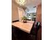 Open concept dining area featuring a table with seating for four, adjacent to the kitchen at 15515 Morning Dr, Lutz, FL 33559