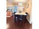 Cozy dining area with seating for four, overlooking the pool through sliding glass doors at 15515 Morning Dr, Lutz, FL 33559
