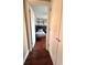 Hallway view to bedroom with patterned wallpaper at 15515 Morning Dr, Lutz, FL 33559