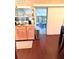 Bright kitchen with wooden cabinets, granite counters, and access to an outdoor patio at 15515 Morning Dr, Lutz, FL 33559