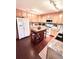 Spacious kitchen featuring wood cabinets, stainless steel appliances, and an island with granite countertop at 15515 Morning Dr, Lutz, FL 33559