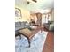 Cozy living room with tile flooring, plush seating, and staircase at 15515 Morning Dr, Lutz, FL 33559