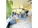 Spacious screened patio with furniture, plants and exercise equipment at 15515 Morning Dr, Lutz, FL 33559