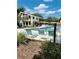 Enjoy the community pool area with plenty of seating and beautiful landscaping, perfect for relaxing on warm days at 15515 Morning Dr, Lutz, FL 33559