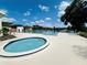 Relax at the community pool with a jacuzzi and plenty of room to lounge and swim on a sunny day at 15515 Morning Dr, Lutz, FL 33559