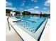 Community pool featuring a diving area and clear blue water with ample space for swimming and exercise at 15515 Morning Dr, Lutz, FL 33559