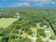 Aerial view of property with a clearly defined boundary offering a tranquil setting surrounded by lush greenery and trees at 13091 Old Crystal River Rd, Brooksville, FL 34601