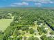 Aerial view of property with a defined boundary and a tranquil setting surrounded by lush greenery and nature at 13091 Old Crystal River Rd, Brooksville, FL 34601