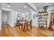 Bright dining room features hardwood floors, neutral walls and stylish shelving for a charming aesthetic at 13091 Old Crystal River Rd, Brooksville, FL 34601