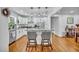 Modern kitchen with granite countertops, stainless steel appliances, and a cozy breakfast bar with seating at 13091 Old Crystal River Rd, Brooksville, FL 34601