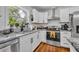 Kitchen features stainless steel appliances, granite counters, and a large window over the sink at 13091 Old Crystal River Rd, Brooksville, FL 34601