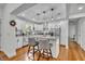 Bright kitchen features white cabinets, granite countertops, stainless steel appliances, and a breakfast bar at 13091 Old Crystal River Rd, Brooksville, FL 34601