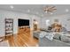Comfortable living room with hardwood floors, neutral paint, and cozy furnishings at 13091 Old Crystal River Rd, Brooksville, FL 34601
