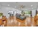 Spacious open-concept living area with hardwood floors and a view of the kitchen at 13091 Old Crystal River Rd, Brooksville, FL 34601