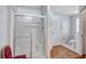 Bathroom featuring a glass-enclosed shower with a seat, as well as a sink and toilet at 9790 66Th N St # 89, Pinellas Park, FL 33782