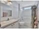Cozy bathroom featuring a shower-tub combo, floral shower curtain, and matching wallpaper at 9790 66Th N St # 89, Pinellas Park, FL 33782