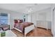 Sunny bedroom featuring a dresser, ceiling fan, and a chair at 9790 66Th N St # 89, Pinellas Park, FL 33782