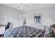 Bedroom featuring laminate flooring, ceiling fan and closet at 9790 66Th N St # 89, Pinellas Park, FL 33782