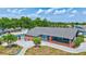 Clubhouse exterior with pool, palm trees, and parking available at 9790 66Th N St # 89, Pinellas Park, FL 33782