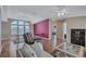 Dining room featuring tray ceilings, modern lighting and a vibrant accent wall at 9790 66Th N St # 89, Pinellas Park, FL 33782