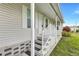 Inviting home entrance featuring well-maintained steps, elegant white railings, and stylish black welcome mats at 9790 66Th N St # 89, Pinellas Park, FL 33782