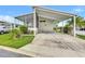 Desirable home with a covered carport, screened-in porch, and well-kept landscaping at 9790 66Th N St # 89, Pinellas Park, FL 33782
