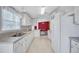 Bright kitchen featuring white cabinetry, ample countertop space, and stainless steel appliances at 9790 66Th N St # 89, Pinellas Park, FL 33782