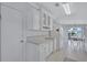 Bright kitchen featuring white cabinetry, ample countertop space, and stainless steel appliances at 9790 66Th N St # 89, Pinellas Park, FL 33782
