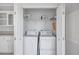Laundry room featuring a washer and dryer and storage at 9790 66Th N St # 89, Pinellas Park, FL 33782