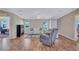 Spacious living room with modern furniture, ceiling fan and view into the office space at 9790 66Th N St # 89, Pinellas Park, FL 33782