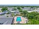 Aerial view of the pool in the community featuring sun loungers and umbrellas at 9790 66Th N St # 89, Pinellas Park, FL 33782