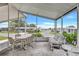 Spacious screened porch with comfortable seating and a lovely view of the community at 9790 66Th N St # 89, Pinellas Park, FL 33782